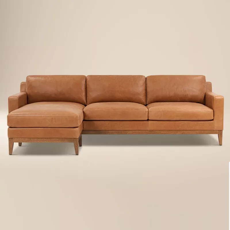 zyon 105. 5″ leather reversible chaise sectional sofa saddle tan